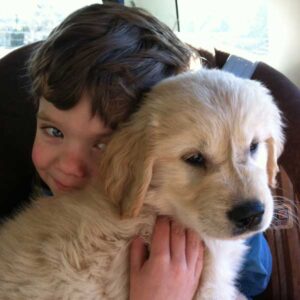 boy and puppy